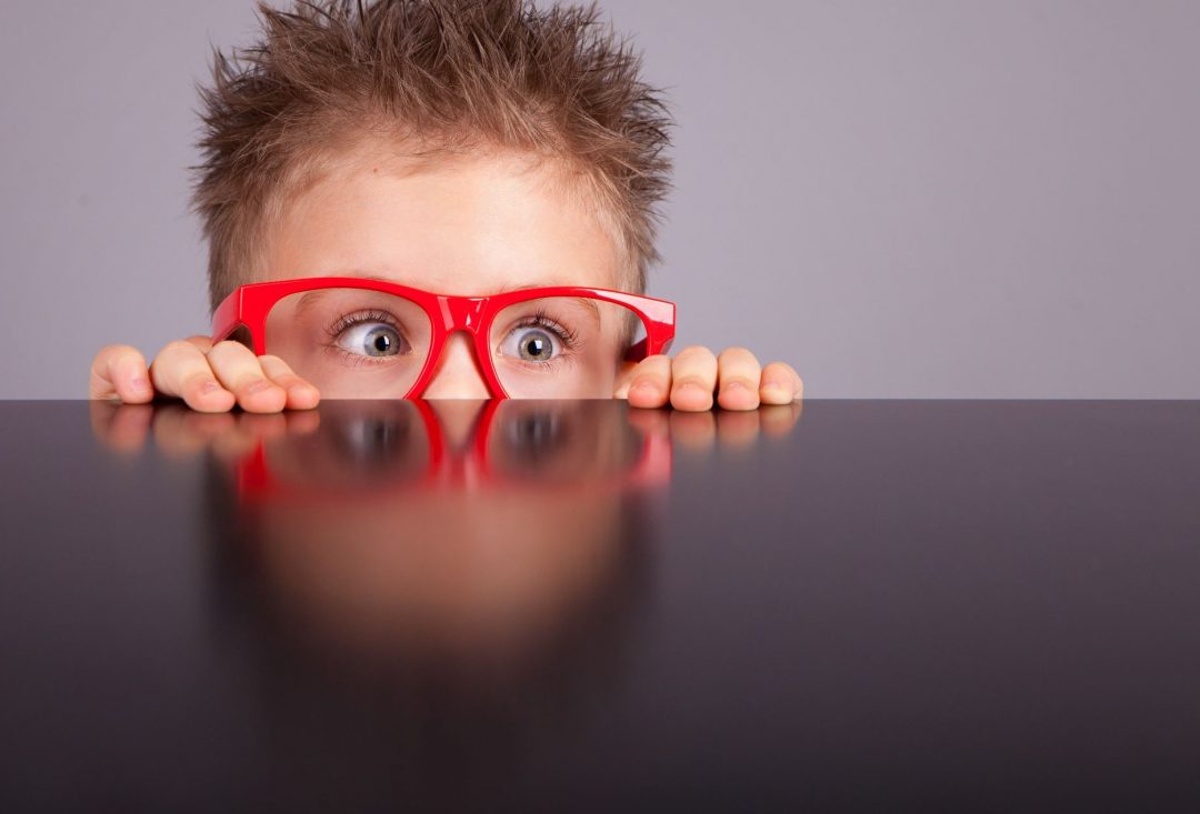 10 Tips for Making Your Blog Post Easier to Read | Edublogs |Boy with glasses peeking over bench